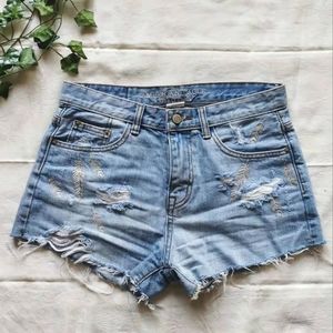 American Eagle blue distressed jean shorts.